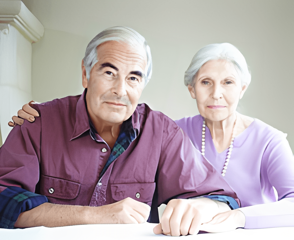 Elderly couple sitting together indoors