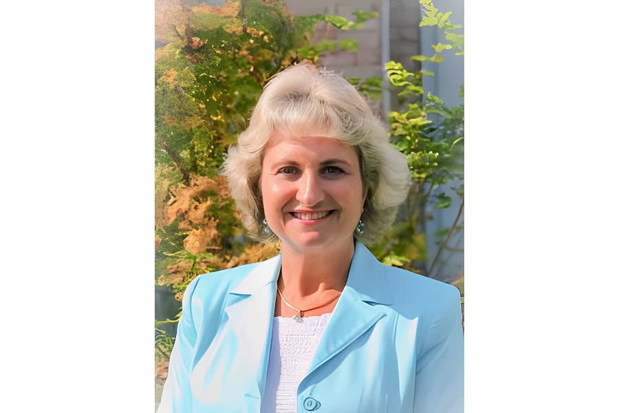 Portrait of woman with trees in background