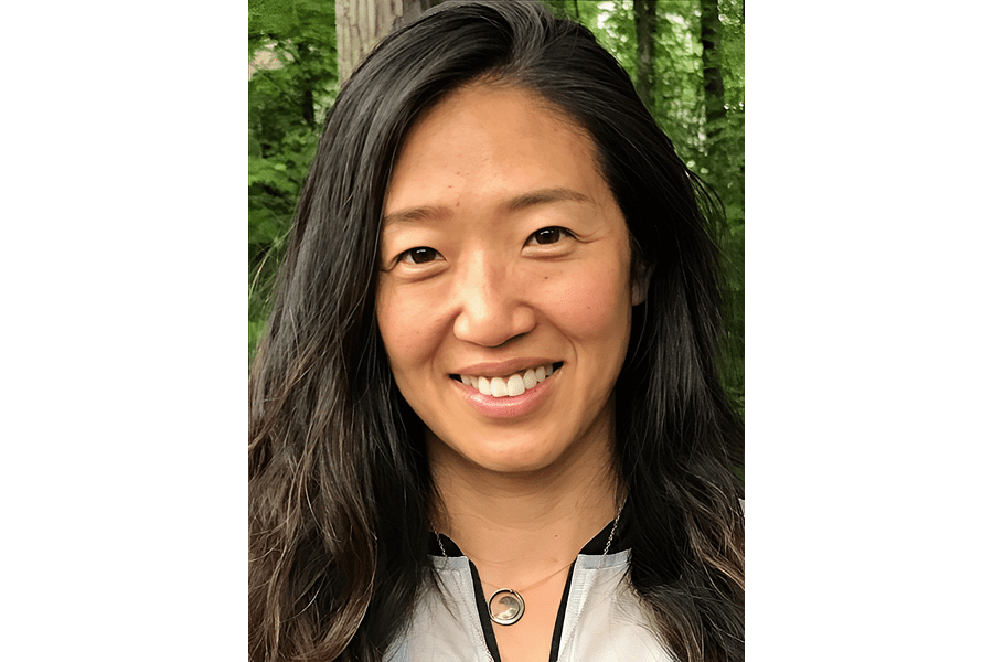 Smiling woman outdoors with long hair